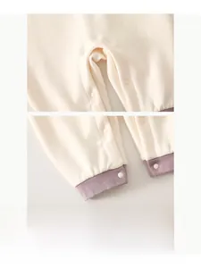 Close-up of baby romper with durable resin snap buttons for easy diaper changes