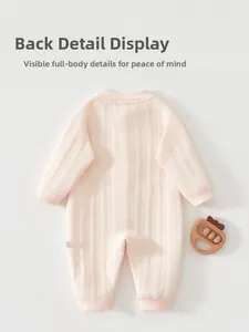 Detailed back view of a soft pink ribbed cotton baby romper for newborns and infants