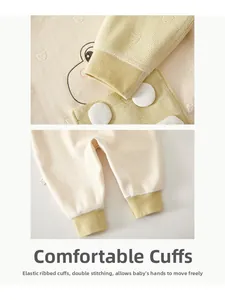 Detail of ribbed cuffs and hem on thermal baby romper with delicate jacquard knit fabric