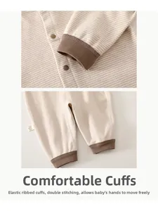 Detail of baby striped romper featuring elastic ribbed cuffs and durable double stitching
