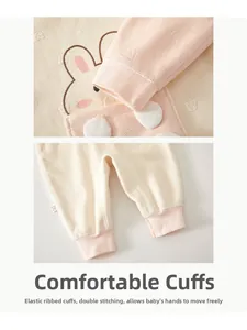 Detail of elastic ribbed cuffs with double stitching on baby winter romper suit