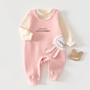 Detailed view of pink baby romper with Little Rabbit embroidery and 3D bunny ears