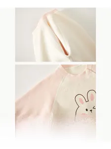 Detail of baby romper featuring smooth bone-free stitching and cute rabbit embroidery