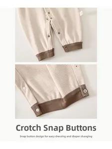 Close-up detail of newborn warm striped romper with snap button crotch closure
