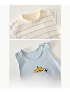 Detail of baby striped cotton T-shirt with ribbed neckline and shoulder snap buttons