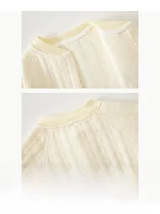Close-up of the baby romper ribbed neckline with soft yellow waffle knit cotton fabric
