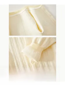 Close-up of seamless cotton baby bodysuit showing soft ribbed knit and flatlock stitching