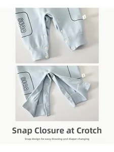 Detail of the baby bodysuit crotch featuring high-quality snap buttons for easy diapering