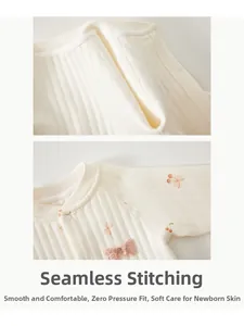 Detail of smooth bone-free seams and cherry print on cotton baby romper fabric