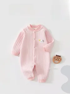 Detail of baby pink padded romper showing ribbed texture and cute animal embroidery