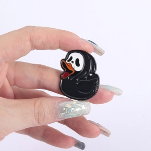 Detailed view of Halloween duck enamel pin with Scream movie mask on a white background