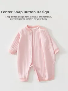 Pink quilted cotton infant romper with vertical rib texture and front snap fasteners