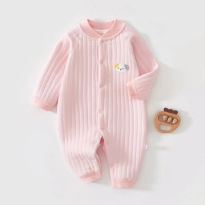 Detail view of pink quilted cotton baby romper with puppy embroidery and ribbed cuffs