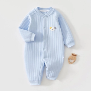 Detail of baby cotton romper featuring ribbed texture and cute puppy applique embroidery