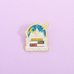 Enamel brooch with dragon and open book design for fantasy book lovers and readers