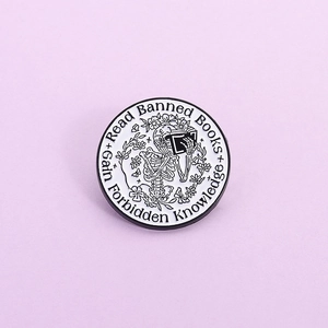 Gothic skull reading book enamel pin badge with floral details and slogan text