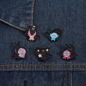 Set of 5 funny raven enamel pins with motivational quotes on blue denim background