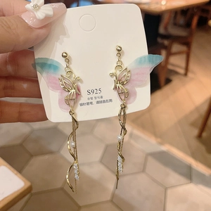 Detailed close-up of butterfly tassel earrings with S925 silver needles and pink-blue gradient wings