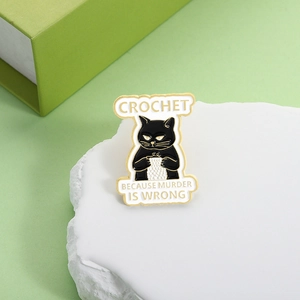 Funny crochet black cat enamel pin badge titled Crochet Because Murder Is Wrong