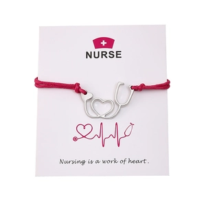 Handmade pink wax rope nurse bracelet with silver stethoscope heart charm on a gift card