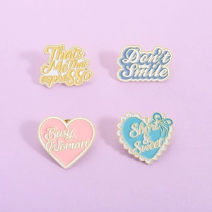 Set of four colorful enamel pins featuring Espresso and Short n Sweet music themes