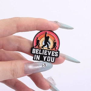 Detailed view of Bigfoot enamel pin with Believes In You slogan and colorful gradient