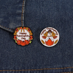 Enamel Thanksgiving pins set featuring turkey and pumpkin designs on denim fabric