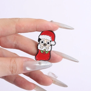 Detail of Christmas Pug enamel pin with festive red stocking and holiday hat design