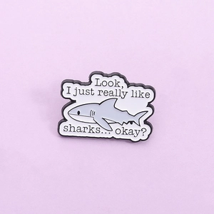 Cartoon shark enamel pin with slogan Look I just really like sharks on purple background