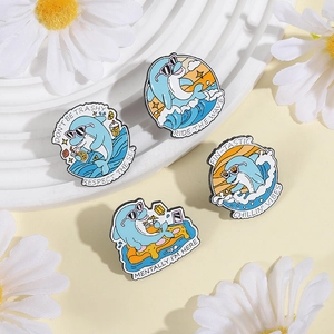 Set of four cute cartoon dolphin enamel pins featuring a ride the wave theme