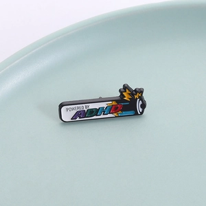 Creative battery-shaped ADHD enamel pin in black metal with colorful lettering and lightning