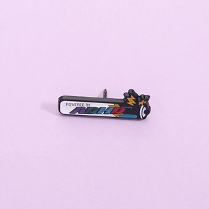 Creative enamel pin with 'POWERED BY ADHD' text on a light purple background