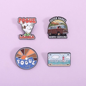 Set of 4 Outer Banks enamel pins featuring Pogue Life logos and van on purple background