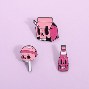 Pink skull enamel pin set featuring cartoon milk box, soda bottle, and lollipop designs