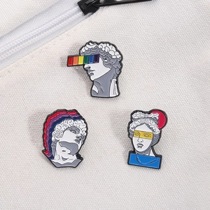 Artistic vintage Greek statue enamel pins set with creative rainbow elements on canvas
