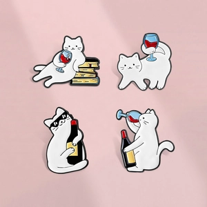 Detailed view of four cute white enamel cat brooches with wine glass and bottle elements