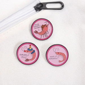 Three pink enamel shrimp pins on white canvas bag with funny puns and creative cartoon art