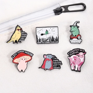 Set of 6 humorous enamel pins featuring funny animals and mushroom motifs on white canvas bag