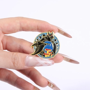 Close-up of a gothic bat enamel pin with mushrooms and golden edges held by hand