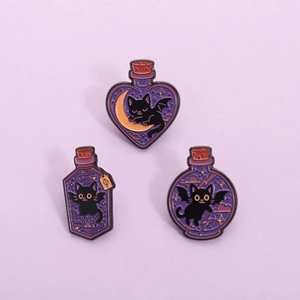 Set of 3 purple enamel pins featuring black cats in magic potion bottles with bats