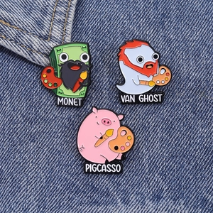 Detailed view of creative Pigcasso and Van Ghost enamel pin set on blue denim fabric