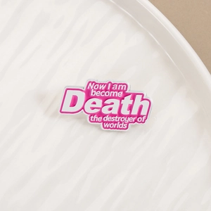 Detail of pink enamel brooch with quote Now I am become Death the destroyer of worlds
