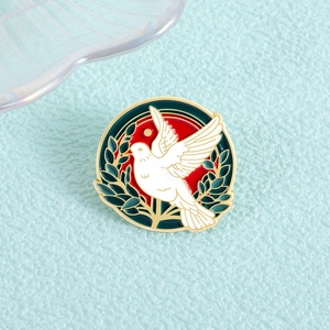 Cartoon white peace dove enamel pin with olive branch on red background circle