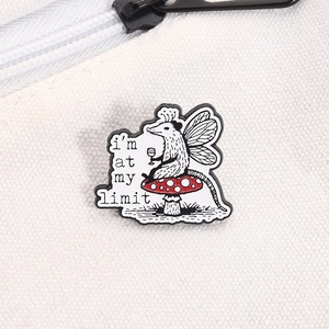 Close-up of opossum enamel pin on mushroom with text I'm at my limit on white canvas bag
