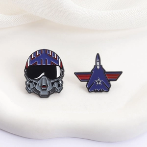 Navy blue pilot helmet and fighter jet enamel pin set with metallic finish and star detail