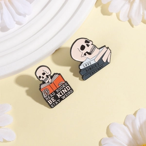 Skull reading books enamel pin set featuring motivational quotes on a decorative plate