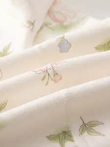Body bébé en coton à fleurs avec coutures plates pour un confort doux optimal