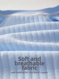 Close-up of soft blue ribbed cotton fabric with breathable texture for baby onesies