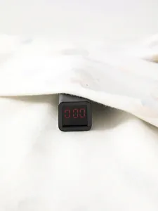 Fluorescence test showing 0.00 reading on pure white cotton long-sleeve baby bodysuit