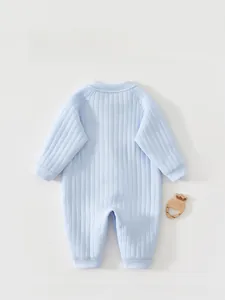 Rear view detail of light blue ribbed knit baby romper with elastic cuffs and soft texture